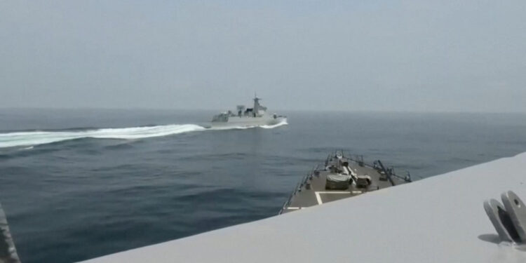 Chinese warship Luyang III sails near the U.S. destroyer USS Chung-Hoon, as seen from the deck of U.S. destroyer, in the Taiwan Strait, June 3, 2023, in this screen grab from a handout video. Defense Visual Information Distribution Service/Handout via REUTERS    THIS IMAGE HAS BEEN SUPPLIED BY A THIRD PARTY