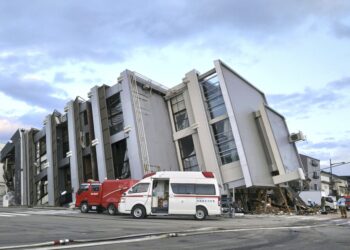 A building falls on the ground following an earthquake in Wajima, Ishikawa prefecture, Japan Tuesday, Jan. 2, 2024. A series of major earthquakes started a fire and collapsed buildings on the west coast of Japan’s main island, Honshu. (Kyodo News via AP)
