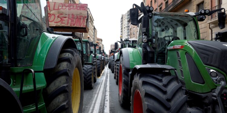 Farmers park their tractors during a protest over price pressures, taxes and green regulation, grievances shared by farmers across Europe, in Pamplona, Spain, February 9, 2024. REUTERS/Vincent West